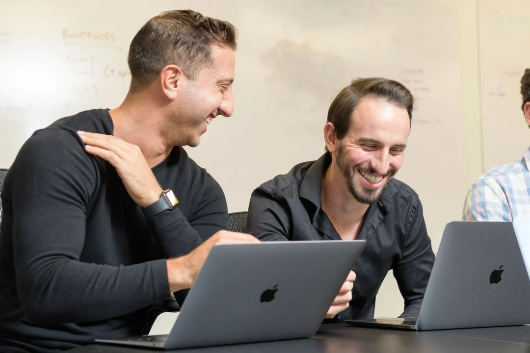 Ringba User Stories - Anthony Sarandrea Laughing with a Team Member